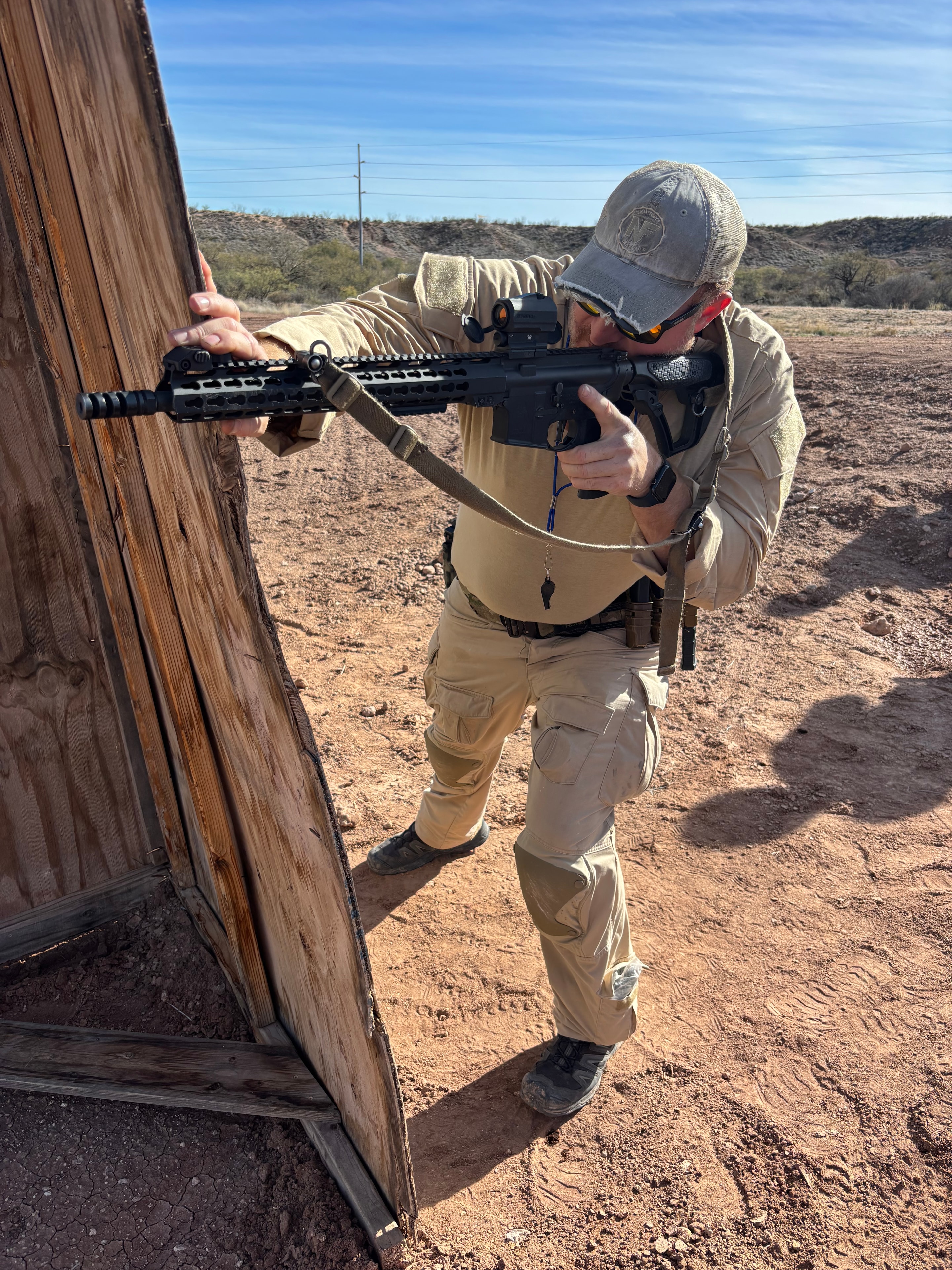Shooter on the line at Veritus Shooting Group desert tactical firearms training range