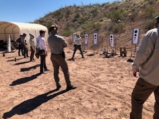 Group firearms training session at Veritus Shooting Group desert range in Phoenix Arizona