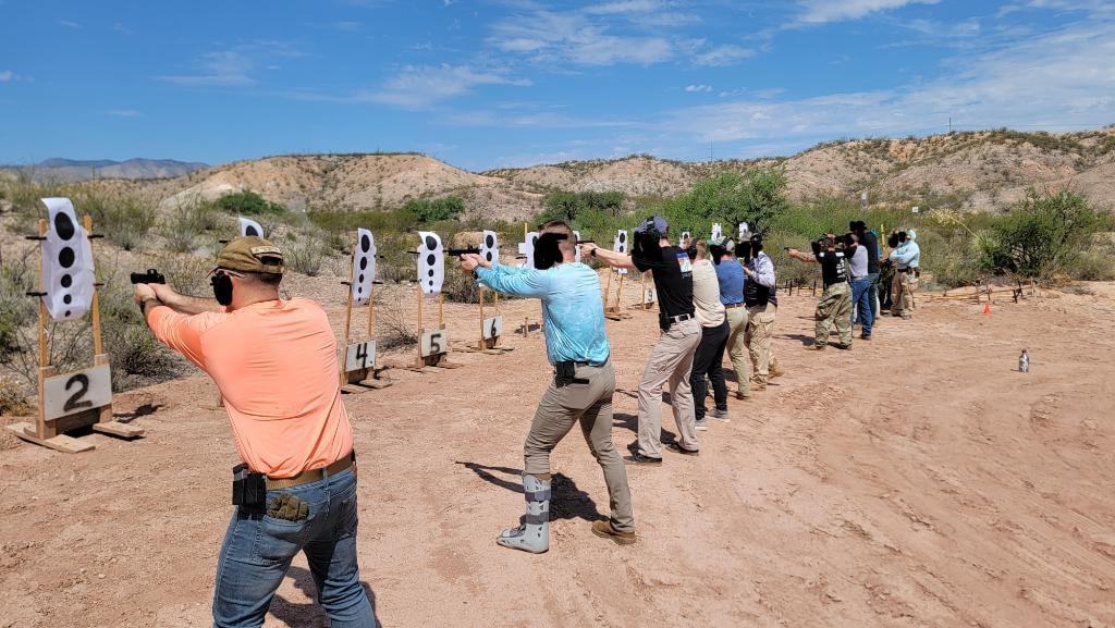 Veritus Shooting Group outdoor desert training range with active shooters on the line