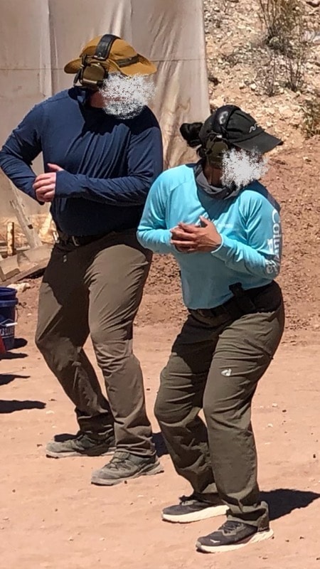 Two students practicing pistol fundamentals at Veritus Shooting Group outdoor range
