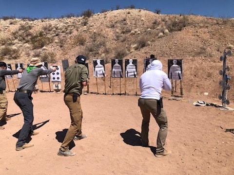 Shooters engaging targets at Veritus Shooting Group outdoor desert range near Phoenix Arizona
